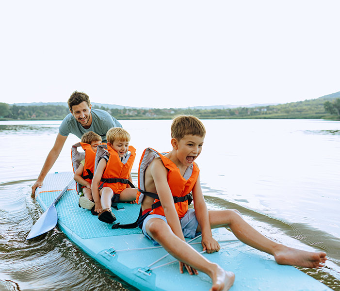 family paddle boarding