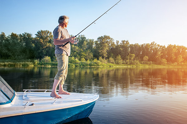 man fishing from a boat